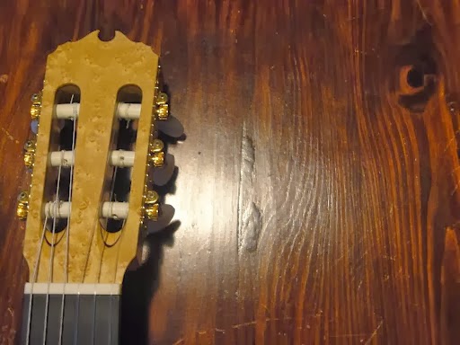 The headstock of David's classical guitar